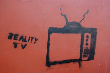 This grafitti in honor of "Reality TV" was found on a wall in a Welsh town.  Photo by "Dean (leu)" of Wales.  Used courtesy of the Creative Commons Attribution ShareAlike 2.0 License. (http://commons.wikimedia.org/wiki/File:TV_graffiti-20070323.jpg)